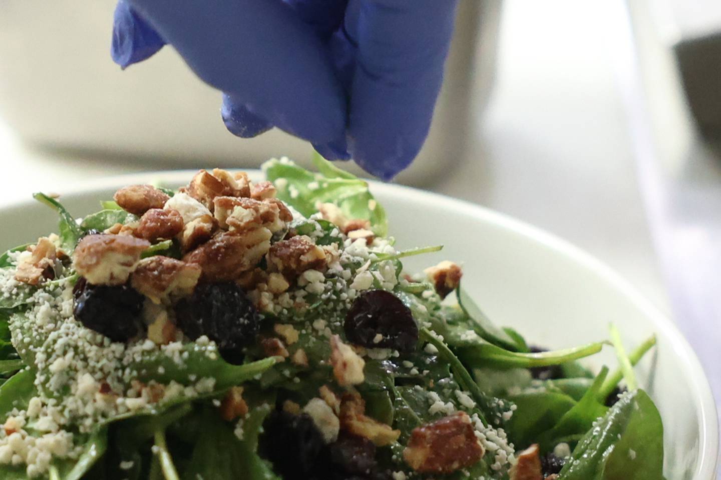 Luis Gachupin prepares an Apple Pecan Salad at Urban Kitchen on Wednesday, Nov. 15, 2023, in Joliet.