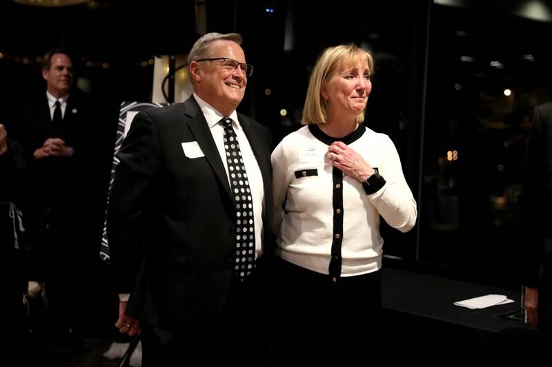 Chuck and Heidi Howlett watch a video as they are announced as the 2024 Geneva Chamber of Commerce Wood Award winners during the chamber’s annual dinner and awards ceremony on Thursday, Nov. 7, 2024 at Riverside Receptions in Geneva.