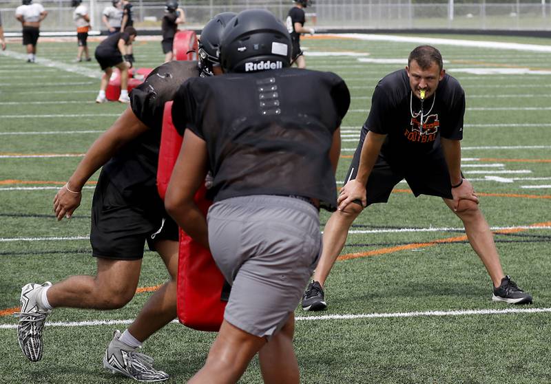McHenry Head Coach Colt Nero watches his team during football practice on Thursday, July 24, 2025, at McCracken Field, in McHenry.