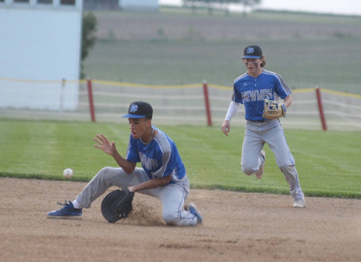 Newman's Isaiah Williams knocks down a ground ball during action at the 1A Pearl City Sectional on Wednesday, May 24.