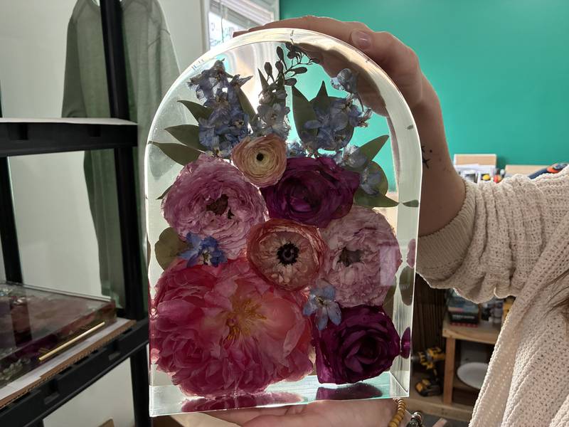 One of the recently-completed dried and preserved arrangements at Bupp Woodworks & Designs on Nov. 28, 2025. The McHenry-based business encase the flowers from weddings and memorial in resin to preserve them.