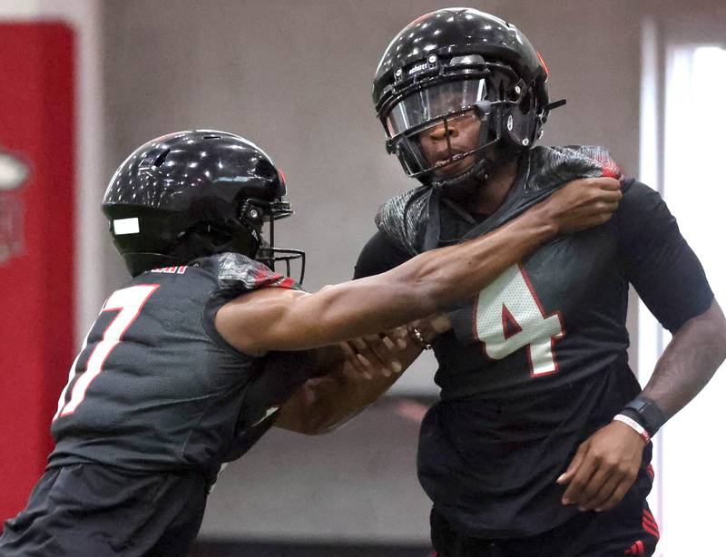 Northern Illinois’ Muhammed Jammeh (right) participates in a drill Wednesday, July 30, 2025, at the teams first practice of the season in the Chessick Practice Center at NIU in DeKalb.