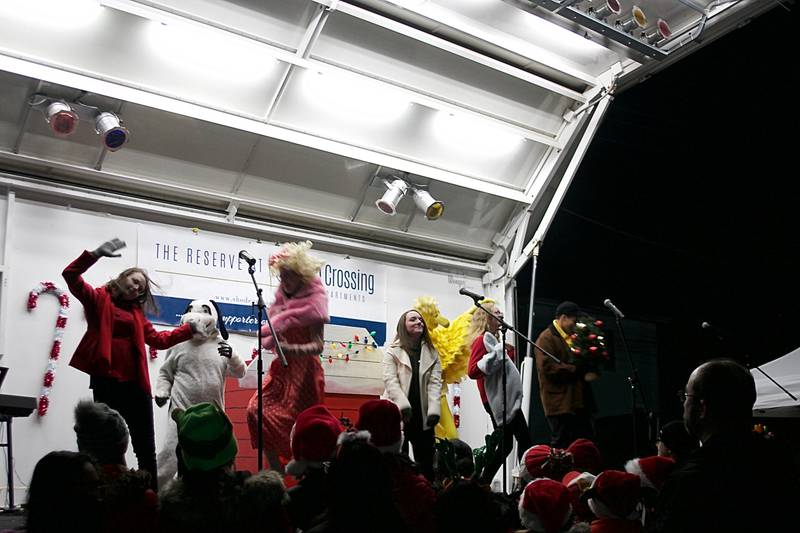 The characters of Charlie Brown and his friends helped Village President Troy Parlier light Oswego's Christmas tree Dec. 3, at the corner of Main Street and Jackson Street.