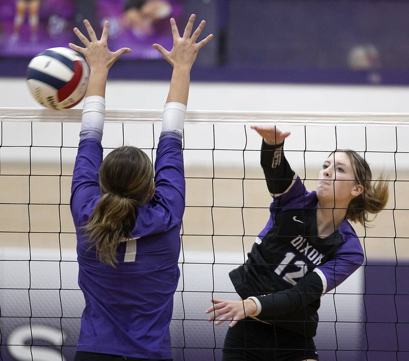 Dixon’s Isabelle Quackboerner spikes the ball against Rochelle Monday, Oct. 28, 2024, during regional play in Dixon.