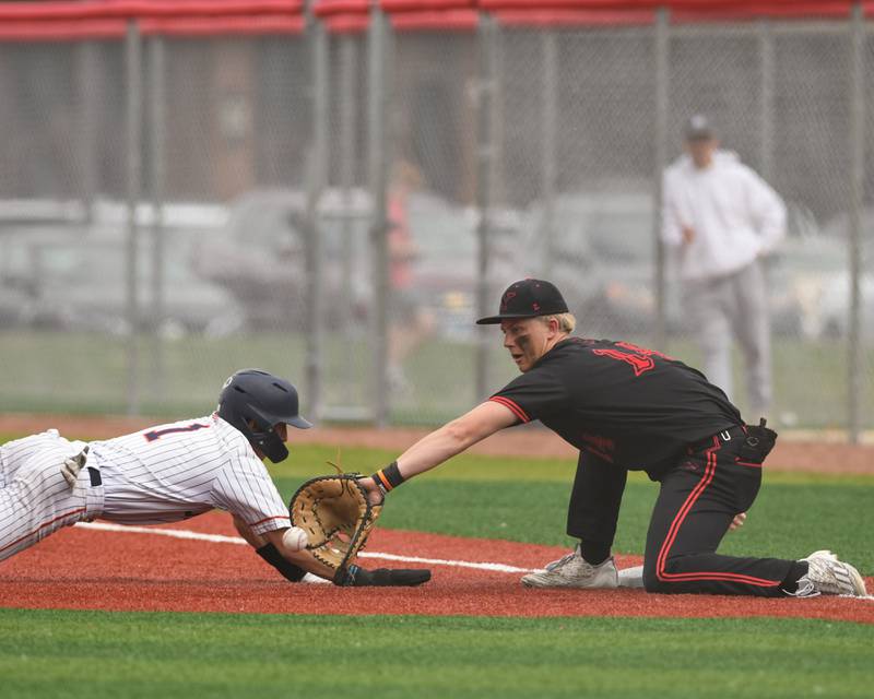 Yorkville's Frank Pavlik, right, checks up Romeoville's Jonny Lee (1) during the regional game on Thursday May 29, 2025, held at Yorkville High School.