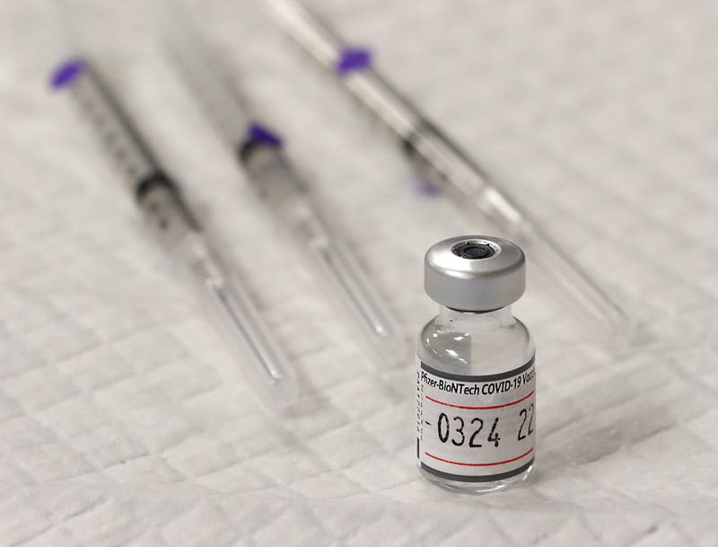 A vial of the Piizer-BioNTech Covid-19 vaccine at a vaccination clinic Monday, Jan. 24, 2022, at the Algonquin Township office, 3702 Route 14 in Crystal Lake. The clinic was put on by the township to help people get they vaccine, after the Omicron variant made getting shots at other locations harder.