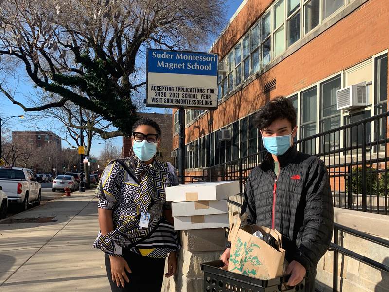 York junior Grant Pinkerton (right) has collected close to 75 used chromebooks to donate to Chicago Public Schools that need them to conduct remote learning.