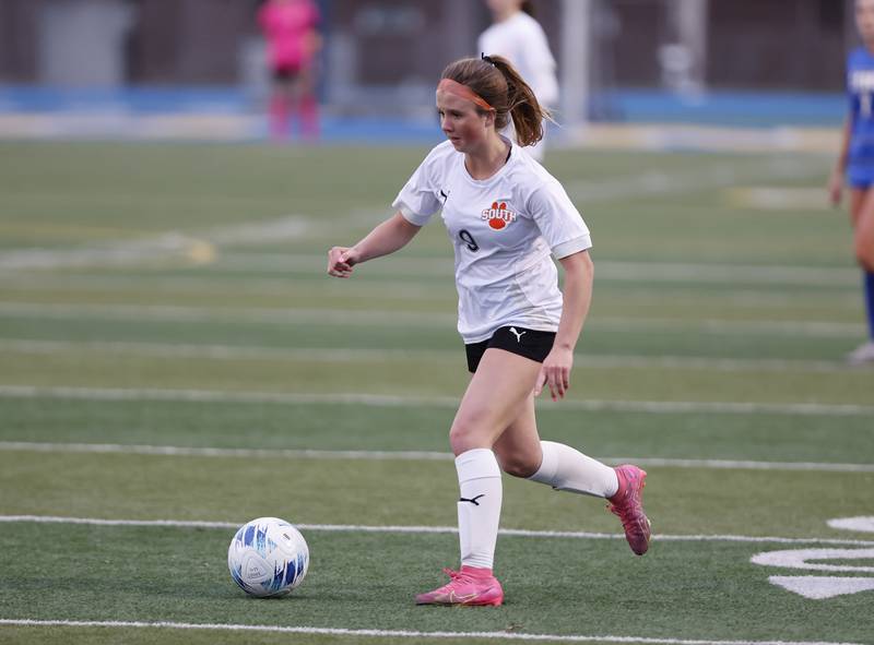 Wheaton Warrenville South's Kelsey Clousing (9) handles the ball during the girl's varsity soccer match between Lyons Township and Wheaton Warrenville South high schools on Thursday, March 27, 2025 in Western Springs.