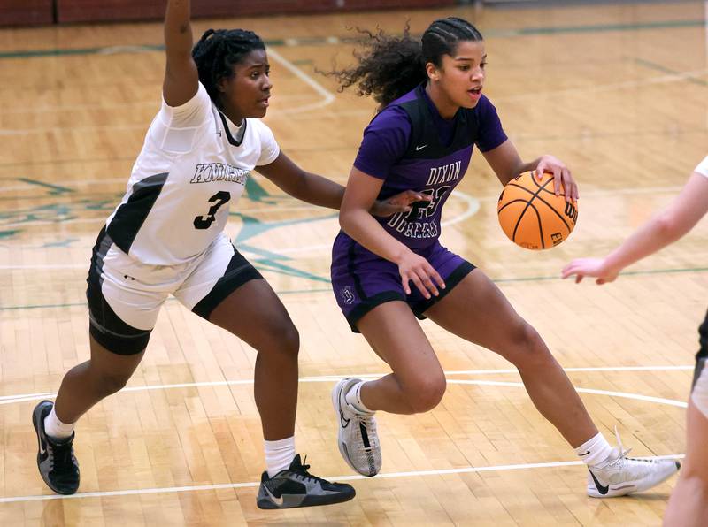 Dixon’s Ahmyrie McGowandrives the lane against Kaneland's Amani Meeks during their Class 3A sectional semifinal game Tuesday, Feb. 25, 2025, at Boylan Catholic High School in Rockford.