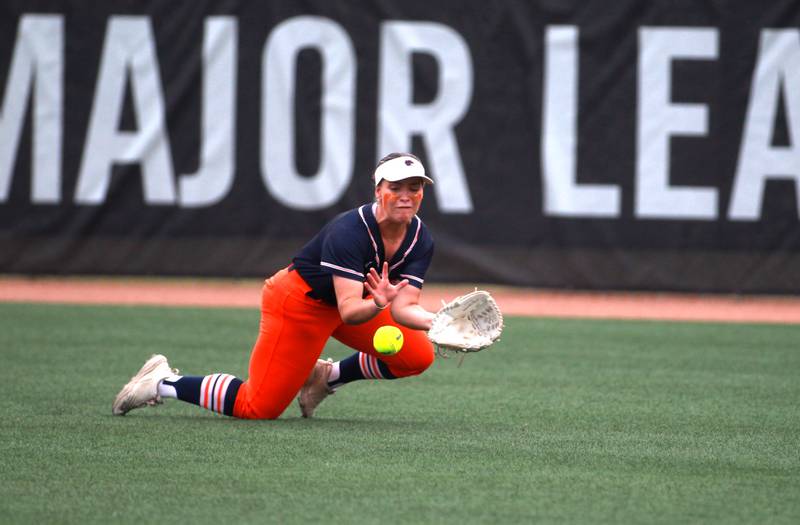 Oswego's Savannah Page stops the ball in the outfield during a IHSA Class 4A state semifinal game against Oak Park-River Forest on Friday, June 13, 2025 at the Louisville Slugger Sports Complex in Peoria.