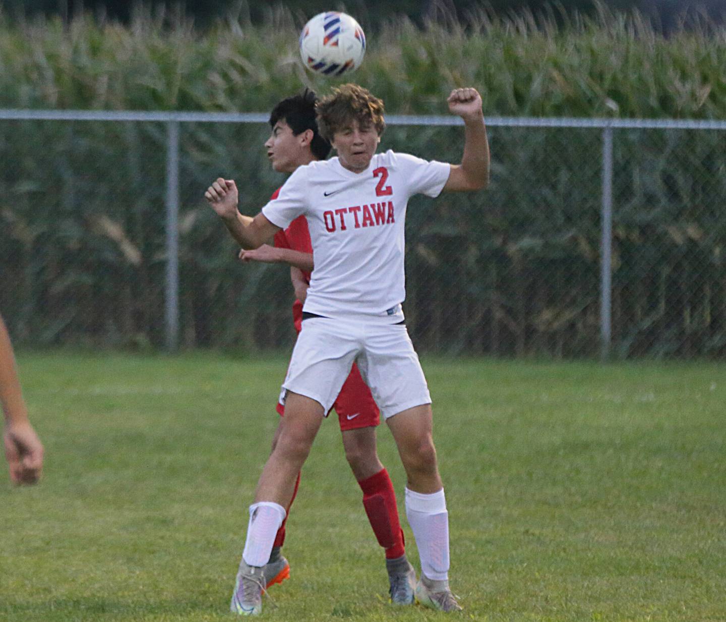 Ottawa's Connor Diederich (2) puts a header on the ball as La Salle-Peru's Adrian Gonzalez defends on Monday, Sept. 12, 2022 at the L-P Sports Complex in La Salle.