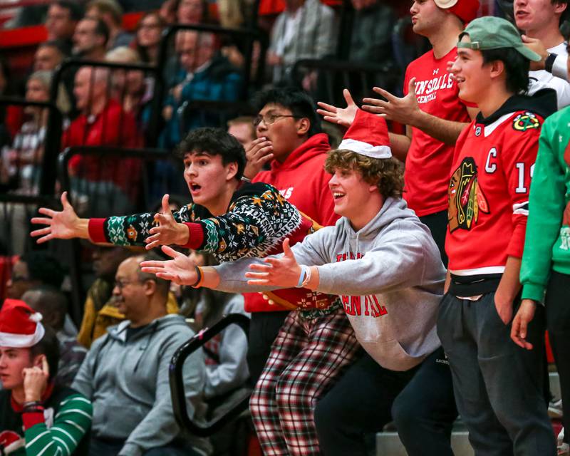 Hinsdale Central's student section disagrees with a call during their basketball game between Glenbard West at Hinsdale Central, Friday  Dec 6, 2024  in Hinsdale.