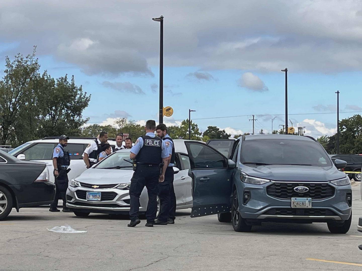 Joliet police officers at the parking lot of Walmart, 2424 W. Jefferson St., on Tuesday, Oct. 7, 2025.