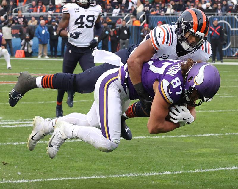 Chicago Bears linebacker T.J. Edwards brings down Minnesota Vikings tight end T.J. Hockenson during their game Sunday, Nov. 24, 2024, at Soldier Field in Chicago.
