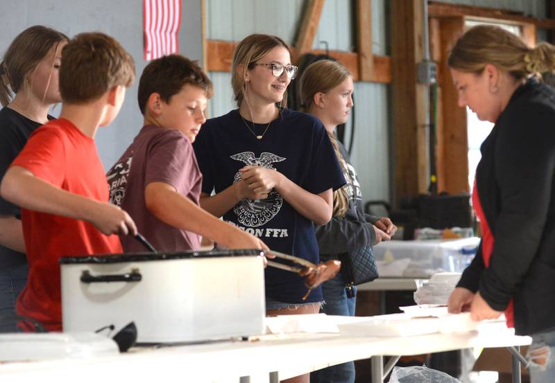 Oregon FFA members will serve pork chops at the Mt. Morris - Oregon FFA Alumni Dinner and Auction on Saturday, June 14 at the Ogle County Fairgrounds.