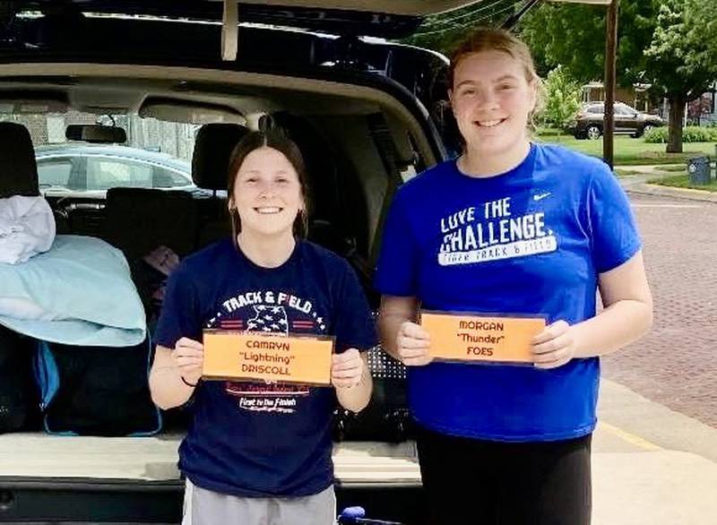 Princeton's Morgan Foes (right) and Camryn Driscoll brought some "Thunder and Lightning" to the Class 2A State Track Meet in Charleston. Foes advanced to Saturday's finals in the discus.