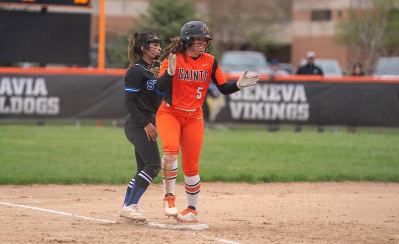 St. Charles East's Nikki Johnston (5) reacts after driving in two runs on a triple against St. Charles North during a softball game at St. Charles East High School on Monday, April 25, 2022.