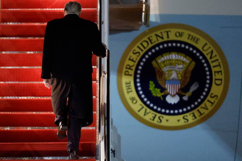 President Donald Trump walks up the stairs of Air Force One as he boards upon his arrival at Joint Base Andrews, Md., Friday, Nov. 7, 2025, en route to his Mar-a-Lago estate in Palm Beach, Fla. (AP Photo/Luis M. Alvarez)