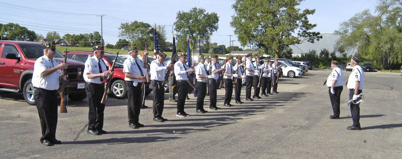 Honor guard members prepare for Rock Falls American Legion Post's Memorial Day ceremony at Lower Dam Park in Rock Falls on Monday, May 26, 2025.