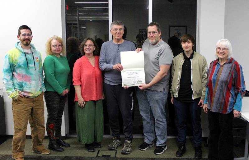 Shaw Local 2024 file – Former Citizens’ Environmental Commission Chair Steve Honeywell (center, right) presents a P.R.I.D.E. Award to Greg Romaneck for his work cleaning up the Kishwaukee River by kayak. The award was renamed STARR for the 2025 recipient.