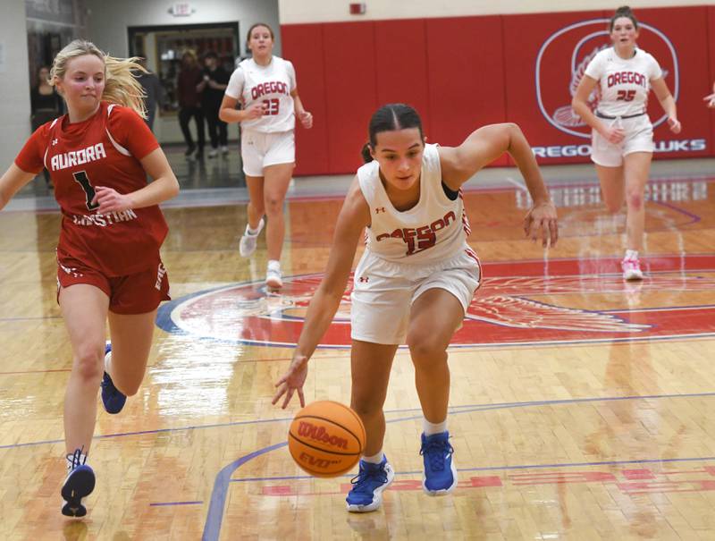 Oregon's Sarah Eckardt (13) scoops up a loose ball and heads to the basket against Aurora Christian at the Oregon Girls Tip-Off Tournament on Friday, Nov. 21, 2025 in Oregon.