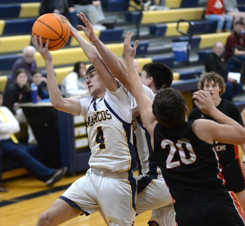 Polo's Mercer Mumford (4) rebounds against Earlville on Monday, Feb. 10, 2025 at Polo High School.