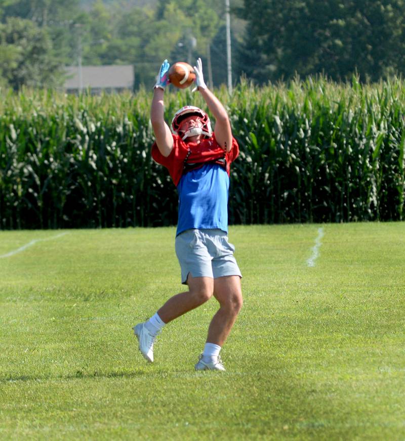 An Oregon High School player reaches to catch a pass during practice on Wednesday, Aug. 13, 2025 in Oregon.