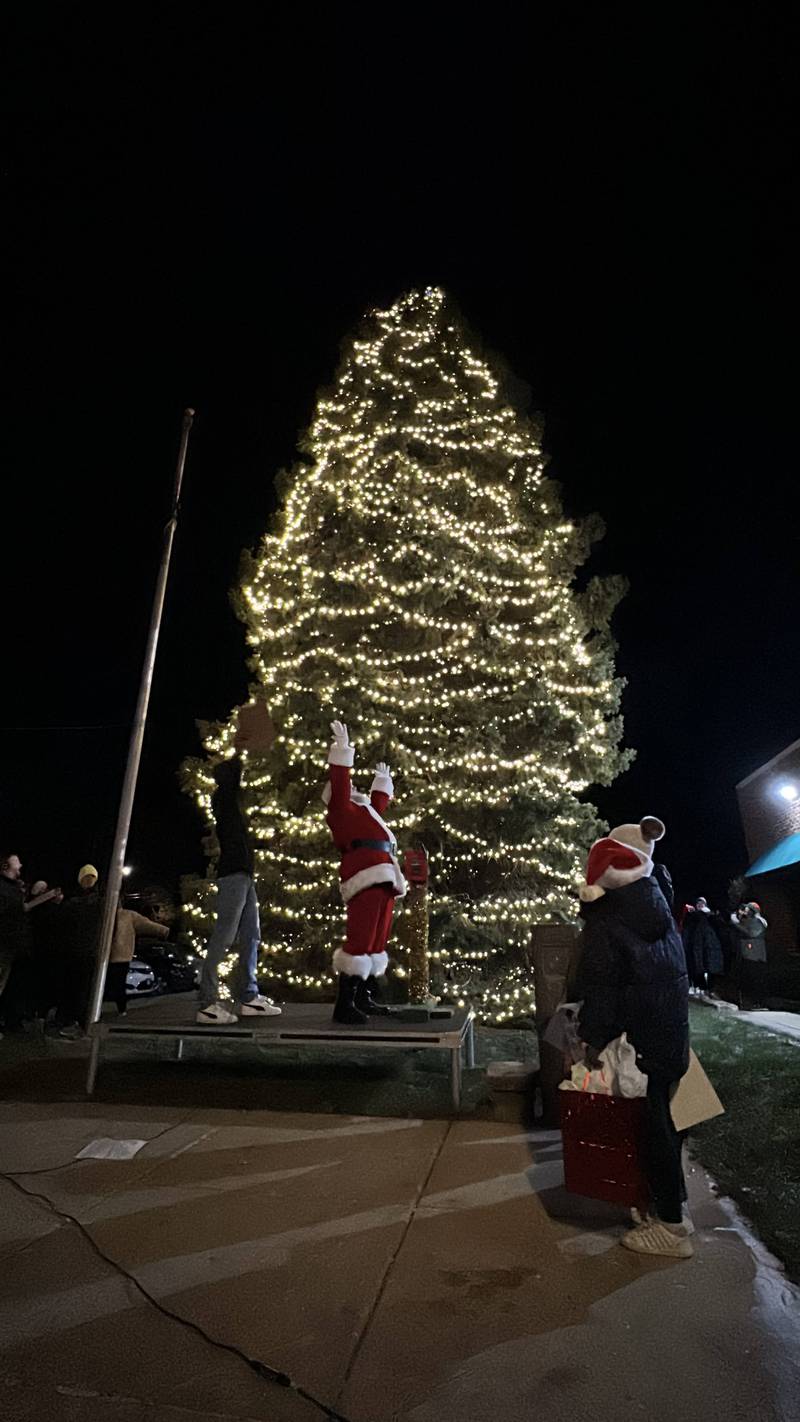 Santa Claus celebrates the lighting of the downtown Genoa Christmas tree during the annual Celebrate the Season event hosted by the Genoa Area Chamber of Commerce on Dec. 6, 2024, downtown.