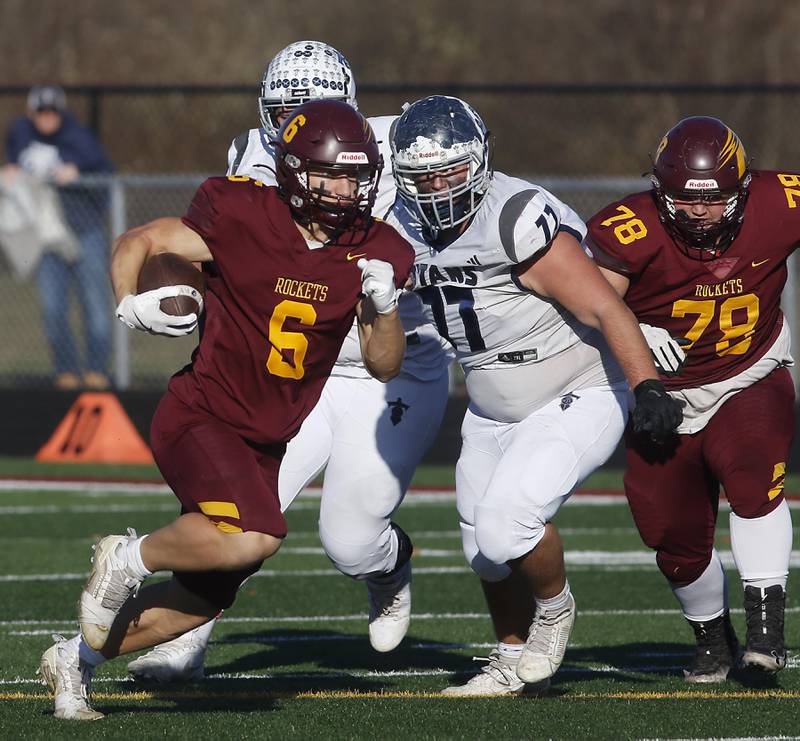 Richmond-Burton's Hunter Carley breaks out of the backfield for a long run against Monmouth-Roseville during an IHSA Class 3A quarterfinal playoff football game on Saturday, November 15, 2025, at Richmond-Burton High School, in Richmond.