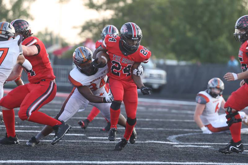 Bolingbrook’s Kelrod Leaks rushes up the middle against Minooka. Friday, Aug. 26, 2022, in Bolingbrook.