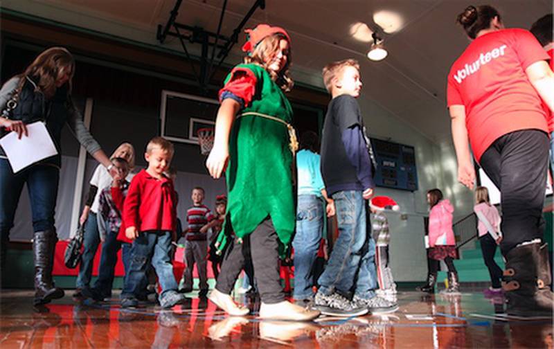 Children participate in a cake walk during Saturday's Holiday in the Grove at the Sugar Grove Community House.