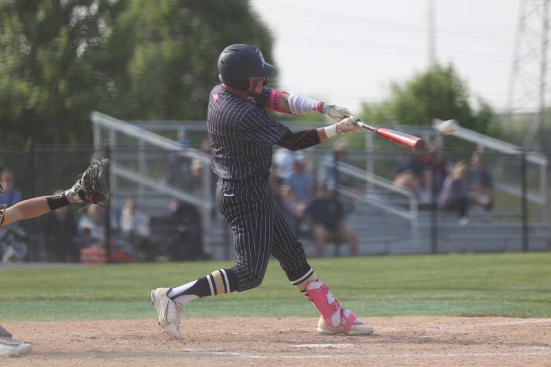 Lemont’s Carter Storti singles against Hinsdale South on Wednesday, May 24, 2023, in Lemont.