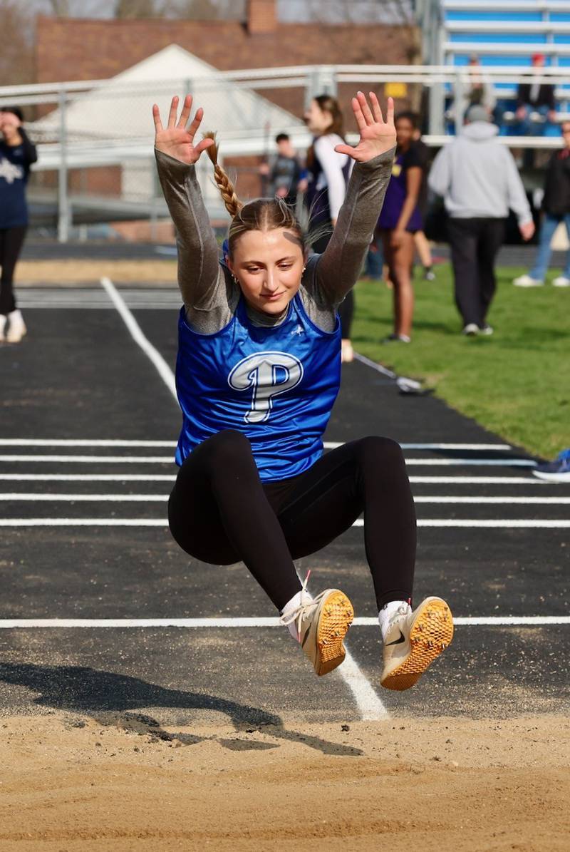 Princeton senior Ashlynn Weber soars in the triple jump in Thursday's Howard-Monier Invite. She won both the long jump and triple jump.