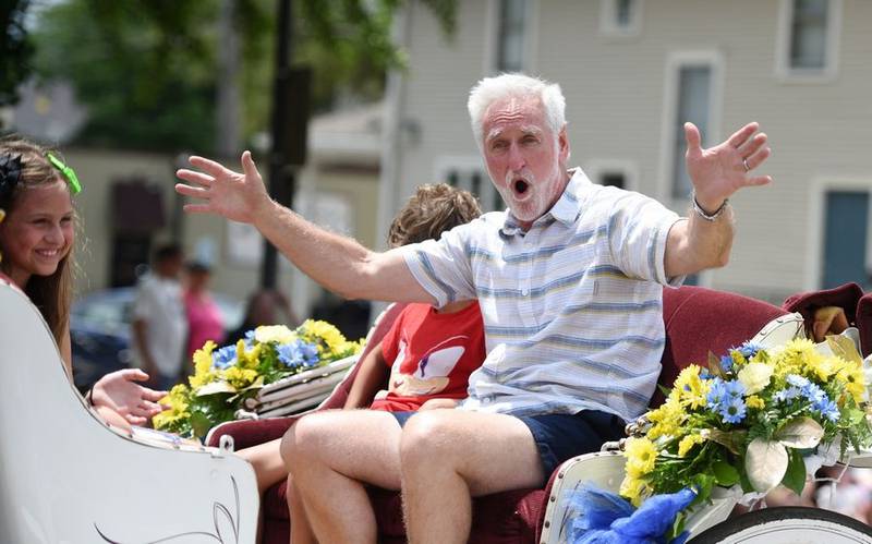 Swedish Days Parade Marshal Jay Womack hollers to the crowd Sunday in Geneva.