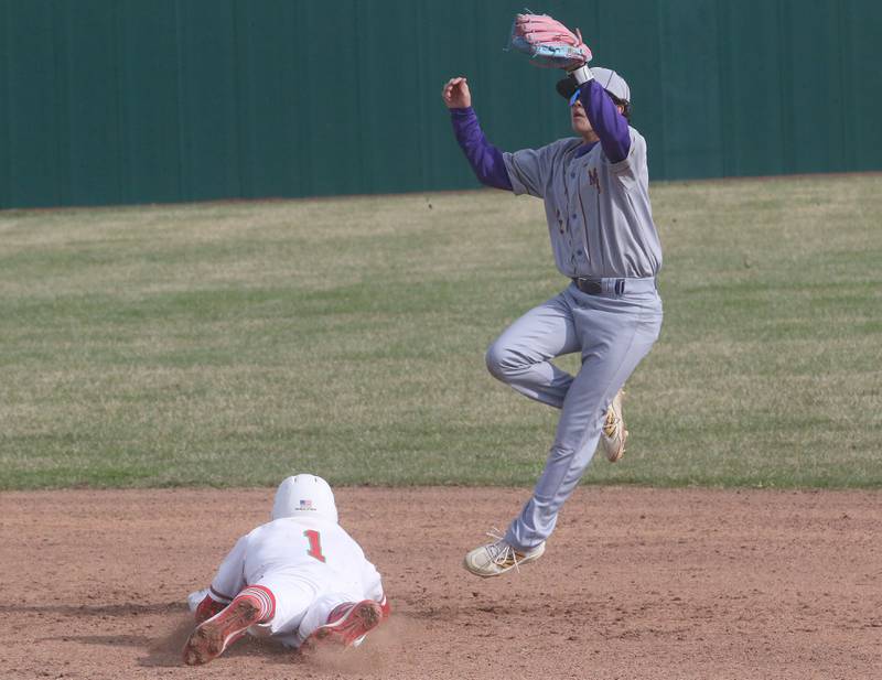 Mendota's Esten Otero leaps in the air to make a catch on a throw down to second base as L-P's Adrian Arzola steals the bag on Thursday, April 3, 2025 at Huby Sarver Field inside the L-P Athletic Complex in La Salle.