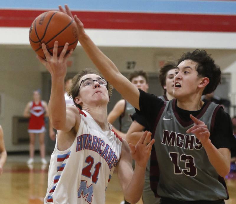 Marengo's Myles Aukes blocks the shot of Marian Central's Finn Pivnicka during a nononference boys basketball game Tuesday, Feb.13, 2024, at Marian Central High School.
