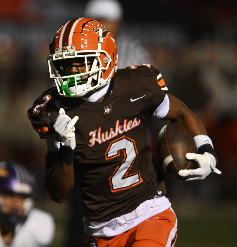 Hersey’s Brandon Jenkins carries the ball for a touchdown against Rolling Meadows during a football game on Friday, Oct. 18, 2024 in Arlington Heights.