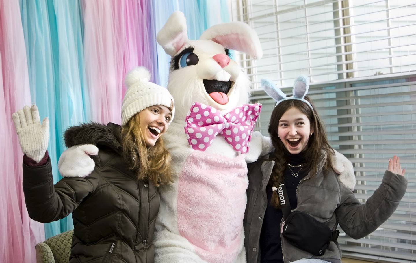 Timbers of Shorewood volunteers Nicole Wolfe,15, and Lexie Dolezal, 16, are all smiles with the Easter Bunny during Timbers of Shorewood Hippity-Hop Easter Egg Hunt Saturday, March 23, 2024, in Shorewood, Ill.