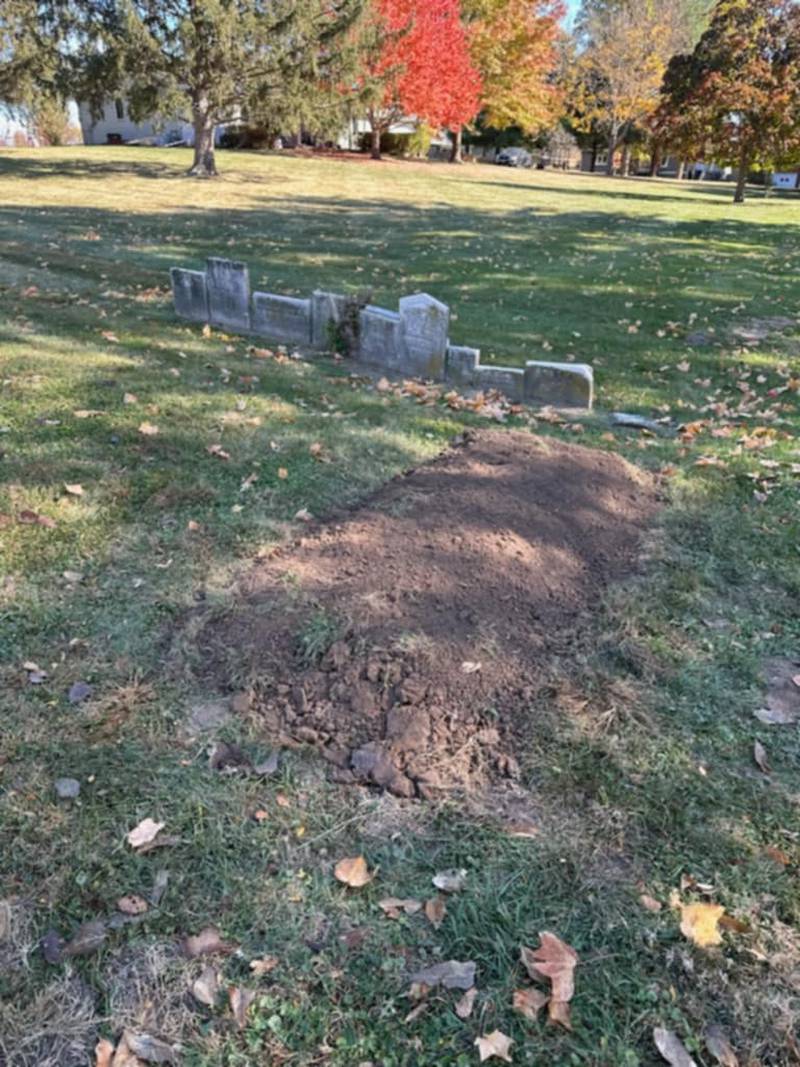 The remains of a woman who died in 1848 that were accidentally unearthed in May by a contractor crew doing utility work in the 200 block of Park Street in Yorkville have been reburied.