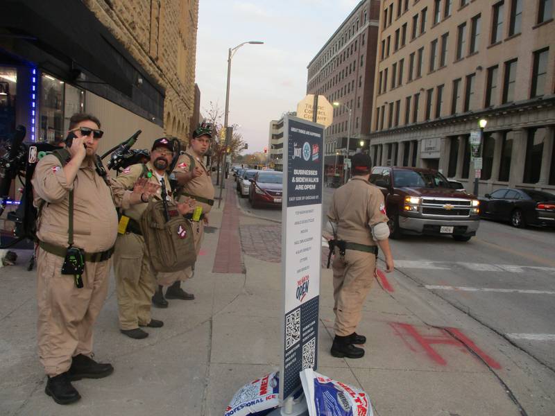 Guys costumed as Ghostbusters head for a ghost tour at the Rialto Square Theatre in downtown Joliet during Spirits With the Spirits night on Wednesday. Oct. 30, 2024