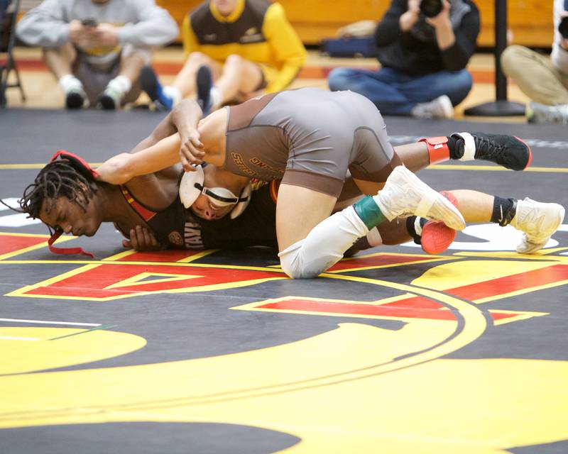 Jacobs Enrique Garcia competes against Batavia's Elias Chaney in the 120 lb weight class at the Clint Arias Invitational on Saturday, Jan.18,2025 in Batavia.