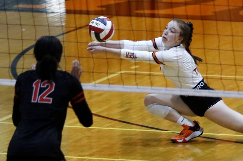 Crystal Lake Central’s Maddie Anderson digs the ball in front of Huntley’s Morgan Jones during a Fox Valley Conference volleyball match Tuesday, Aug. 23, 2022, between Crystal Lake Central and Huntley at Crystal Lake Central High School.