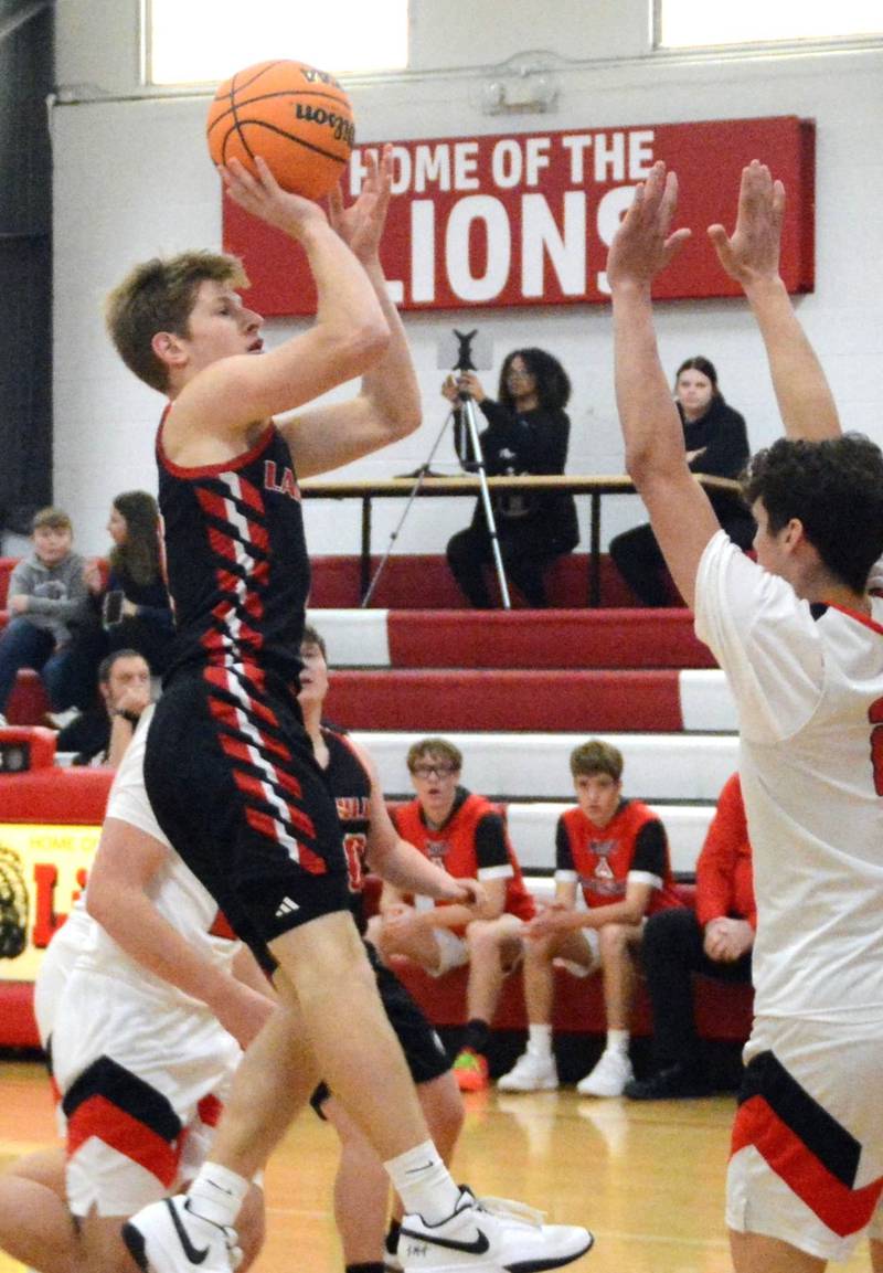 LaMoille's Brayden Klein takes aim against Amboy in Saturday's third-place game of the LaMoille Holiday Classic. The Clippers won 55-45.