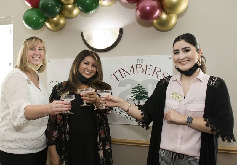 Timbers of Shorewood celebrated its 20th anniversary on Thursday, October 13, 2022, in Shorewood, Ill.  Pictured, from left, are Amy Odell, director of activities, Sheila Albor, director of marketing, and Stacy Ascencio, leasing coordinator.