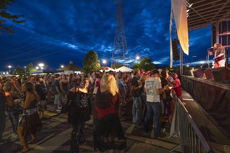 Petunia Fest goers dance Thursday, July 4, 2024 to the Funky Munks.