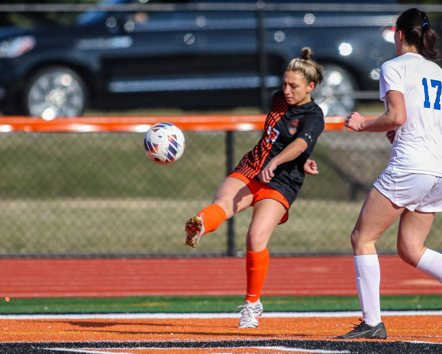 St. Charles East's Mia Raschke (17)  kicks on goal during soccer match between Burlington Central at St. Charles East.  March 28, 2023.