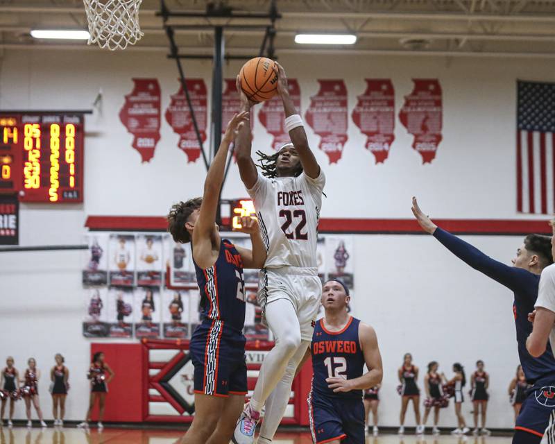 Yorkville's Braydon Porter (22) puts up a shot off of a drive down the lane during their basketball game between Oswego at Yorkville Friday, Dec 12, 2025 in Yorkville.