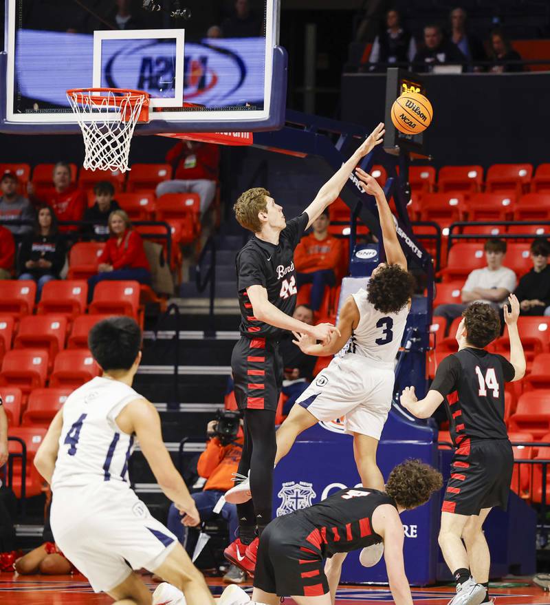 Benet’s Colin Stack (42) blocks a shot by DePaul College Prep's AJ Chambers (3) during the IHSA Class 4A boys basketball state semifinal Friday, March 13, 2026 at the State Farm Center in Champaign.
