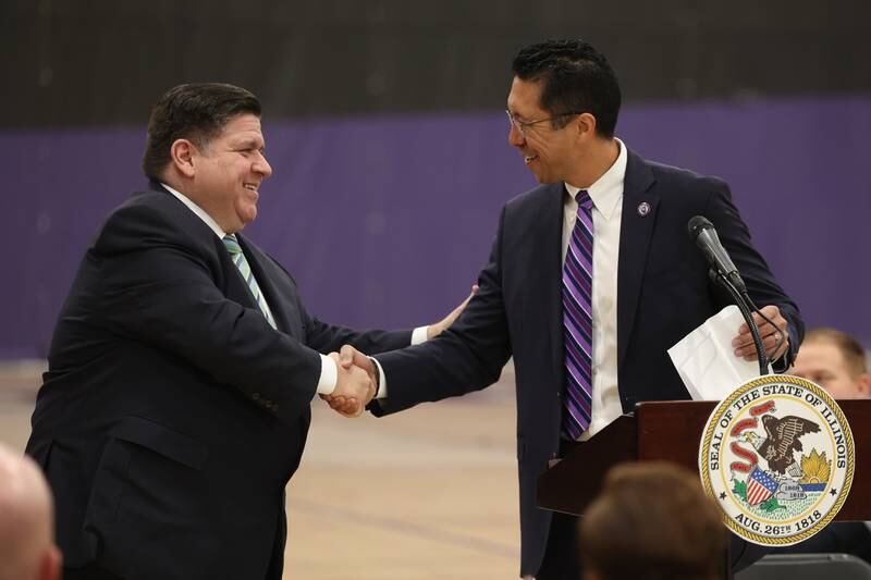 JJC President Dr. Clyne Namuo (right) shakes hands with Illinois Governor JB Pritzker during a press conference regarding the state’s proposed investment in higher education at Joliet Junior College on Thursday, March 16th, 2023.