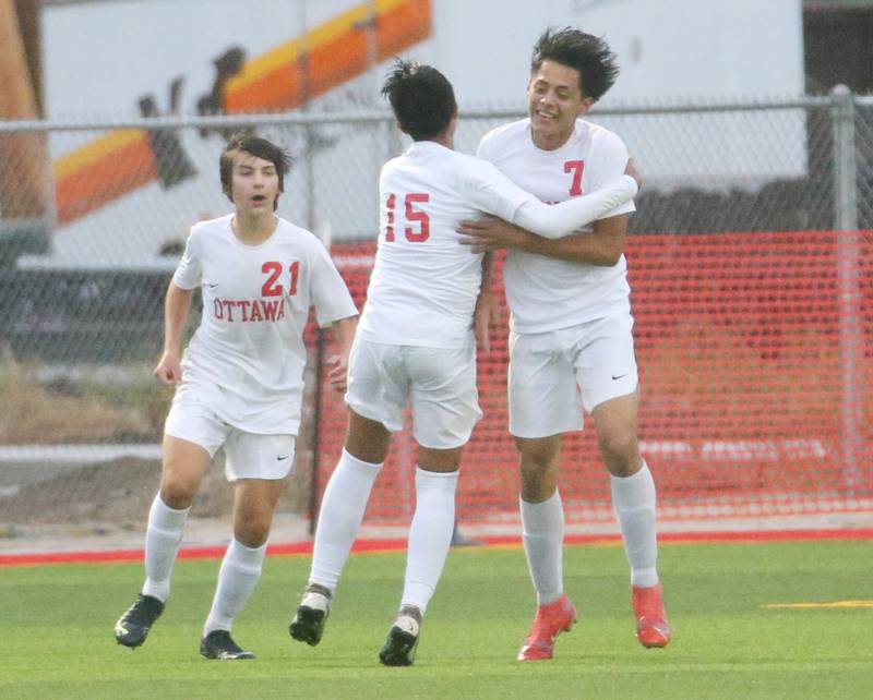 Ottawa's Alexio Fernandez, Michael Bedolla, and Mason Jaegle celebrate after scoring against L-P on Monday, Sept. 11, 2023 at the L-P Athletic Complex in La Salle.